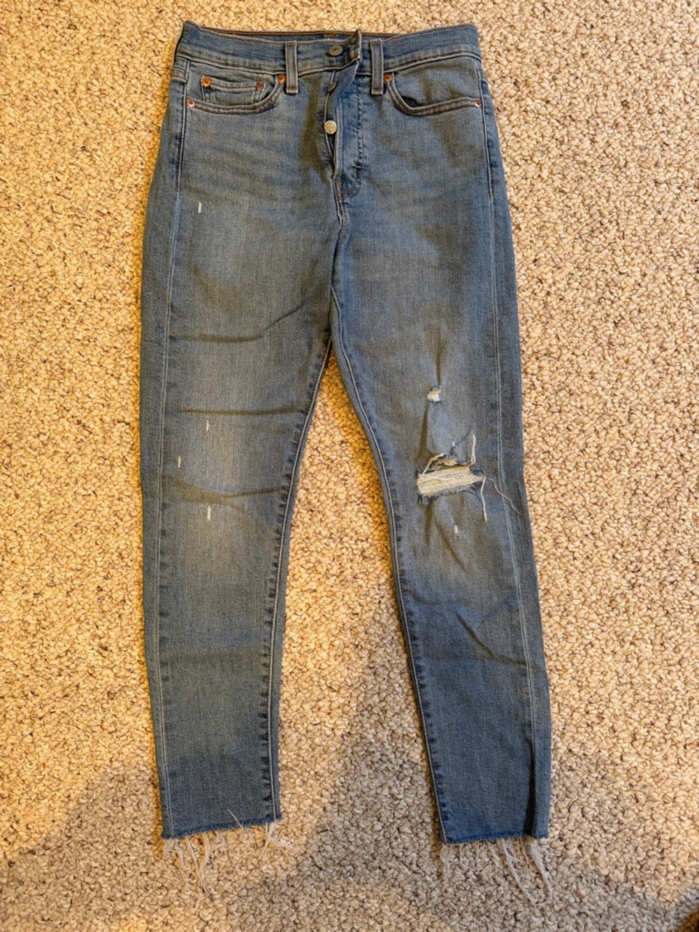Levi's Women's Skinny Jeans in Medium Blue with Ripped Knee